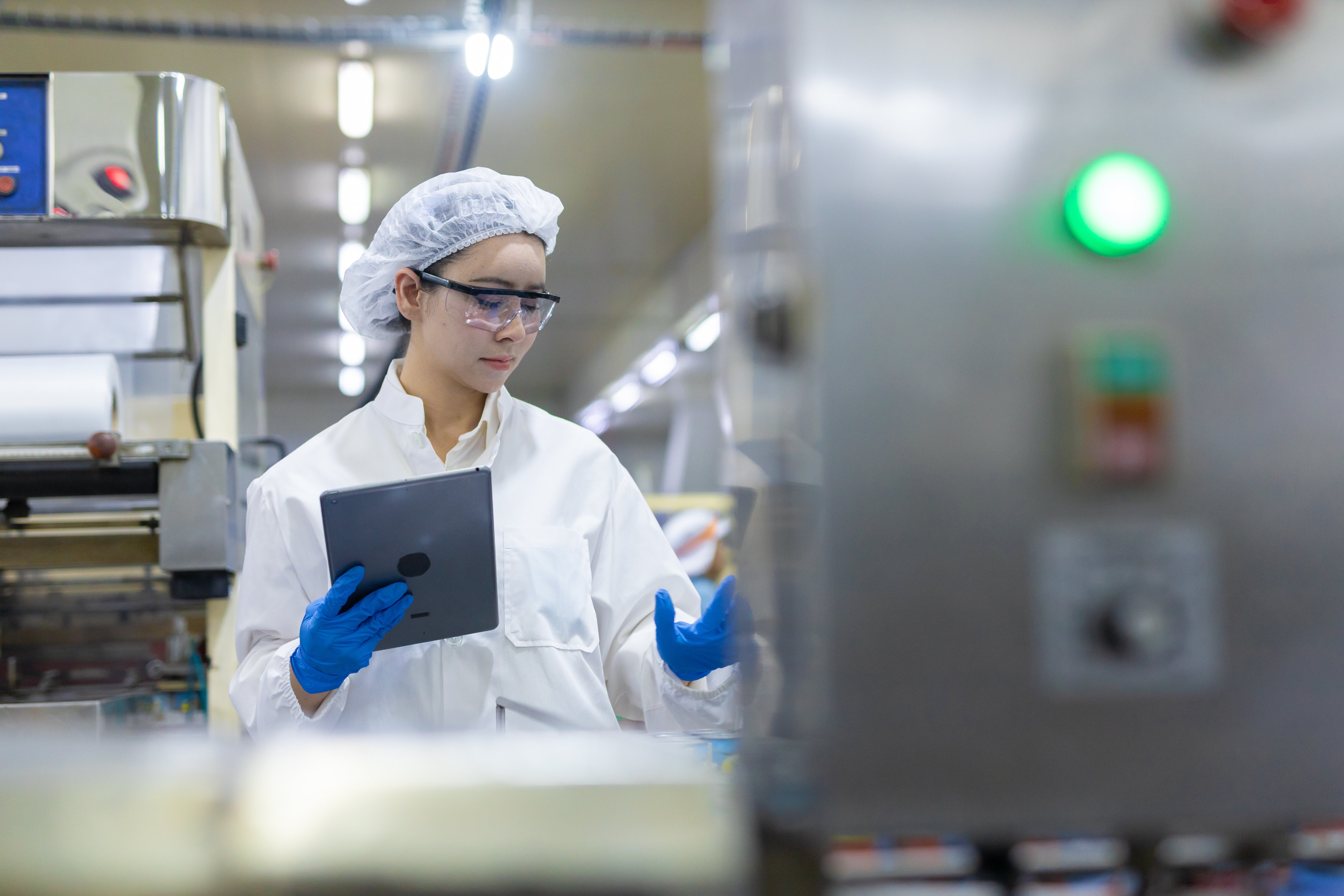 quality-control-technician-using-tablet-in-canned-2026-07-29-01-08-59-utc